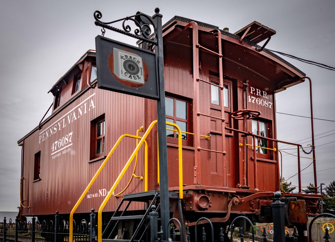 a train is parked on the side of a building