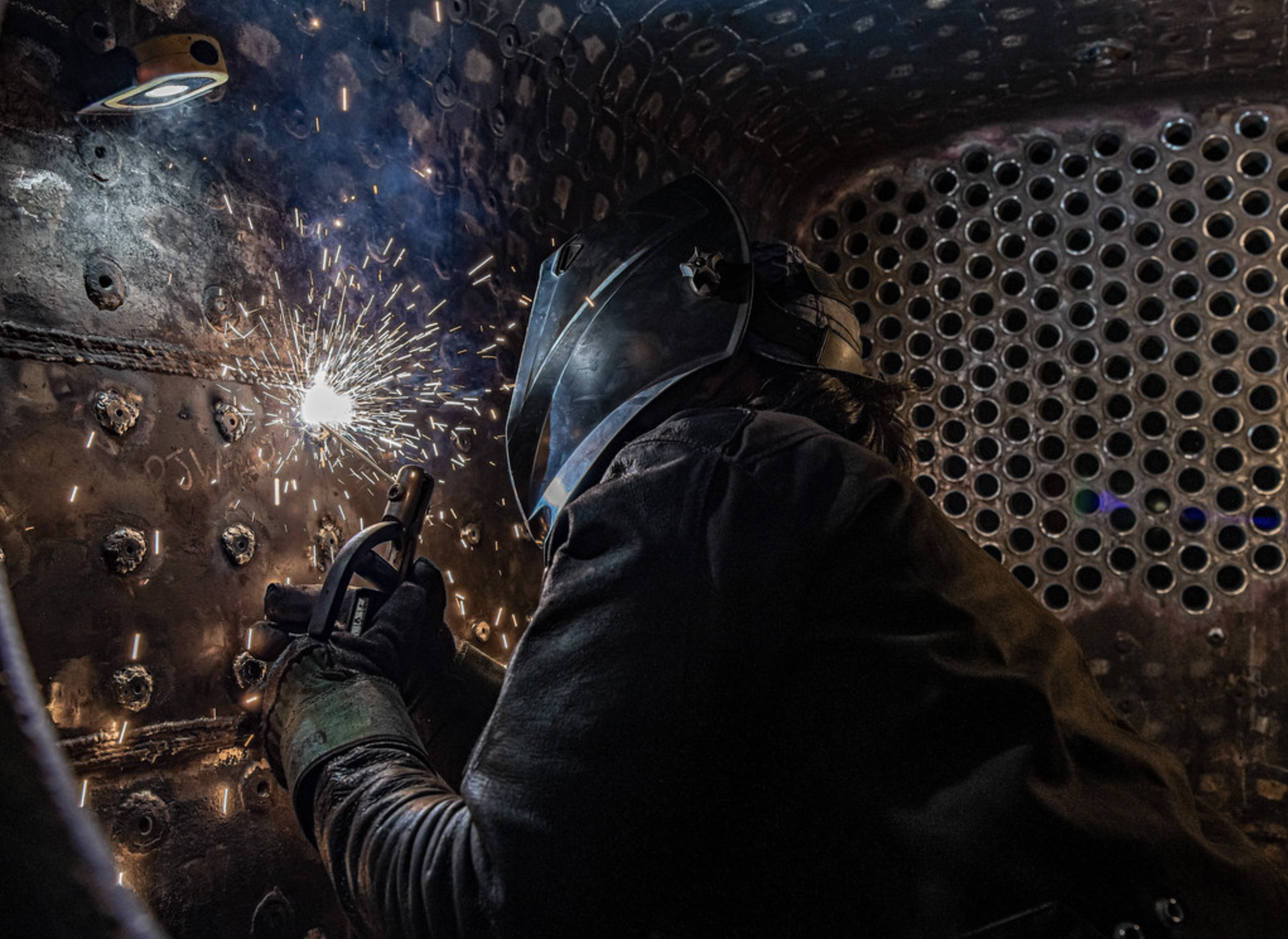 A mechanical shop worker welding at the Strasburg Rail Road.