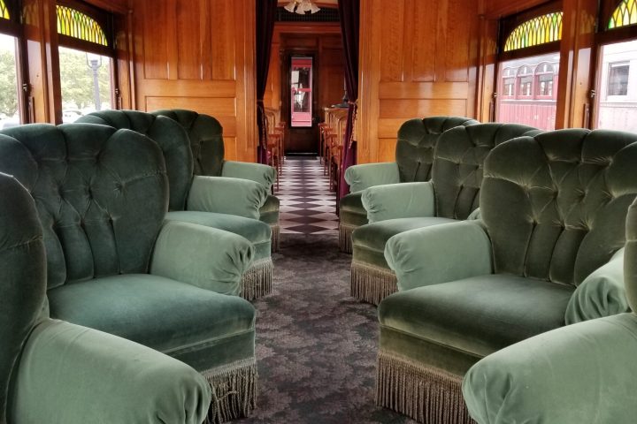 A first class car with two rows of lounge chairs on the Strasburg Rail Road.