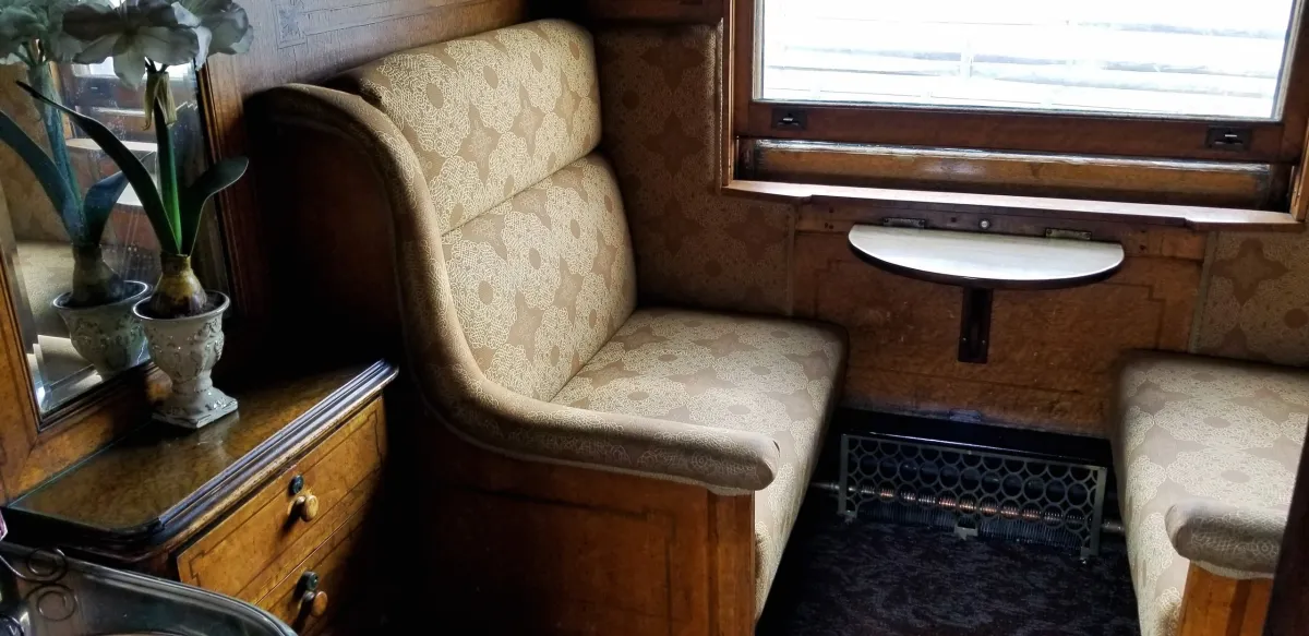 The Elegant Express: Valentine’s Day – The President’s Car Image 6 Comfortable window seats facing each other on a train.