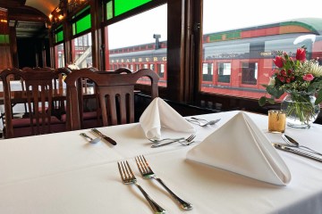 A nicely set table inside the dining car of the Strasburg Rail Road.