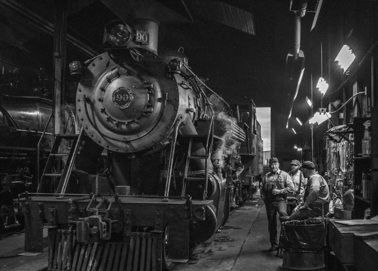 steam_repair Three guys inside the mechanical department at the Strasburg Rail Road next to train #90.