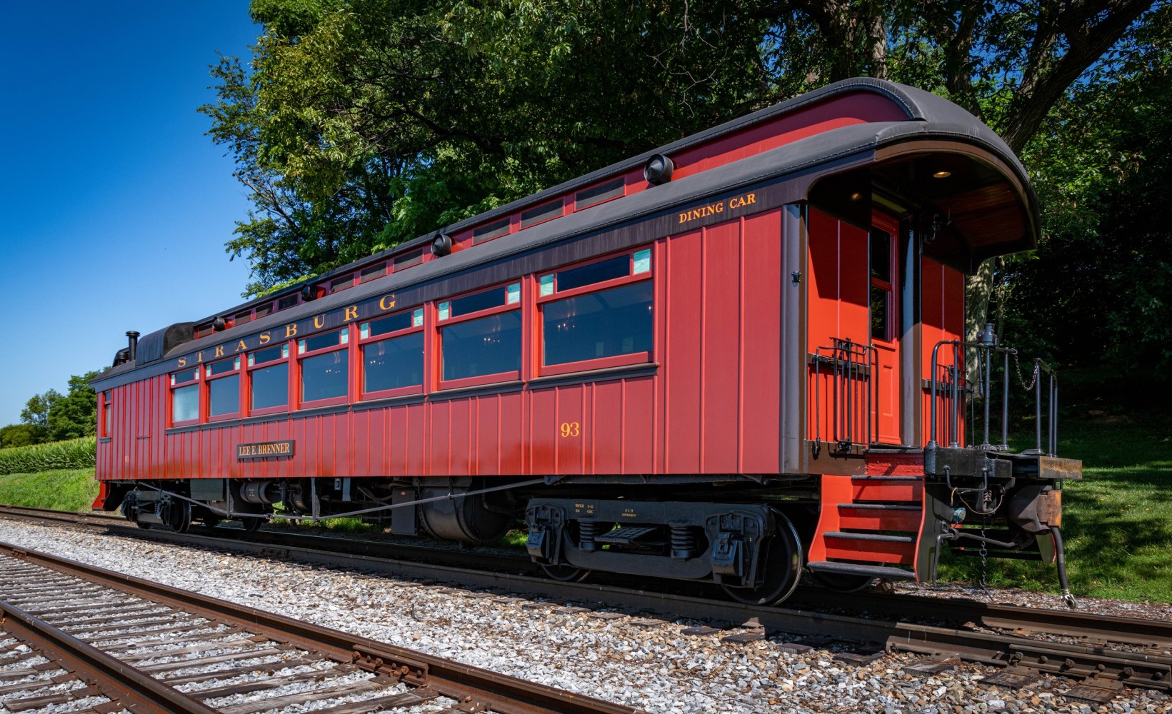 Strasburg Rail Road dining car train parked on a steel track.