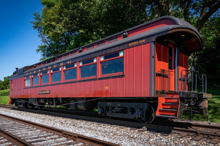 Strasburg Rail Road dining car train parked on a steel track.