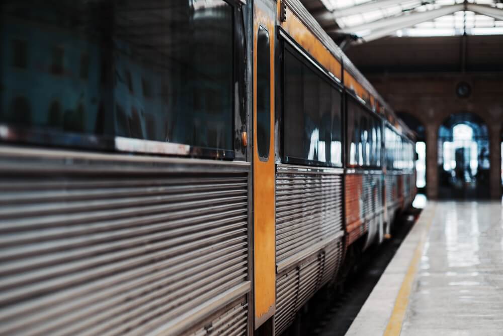 A subway train inside a train station.