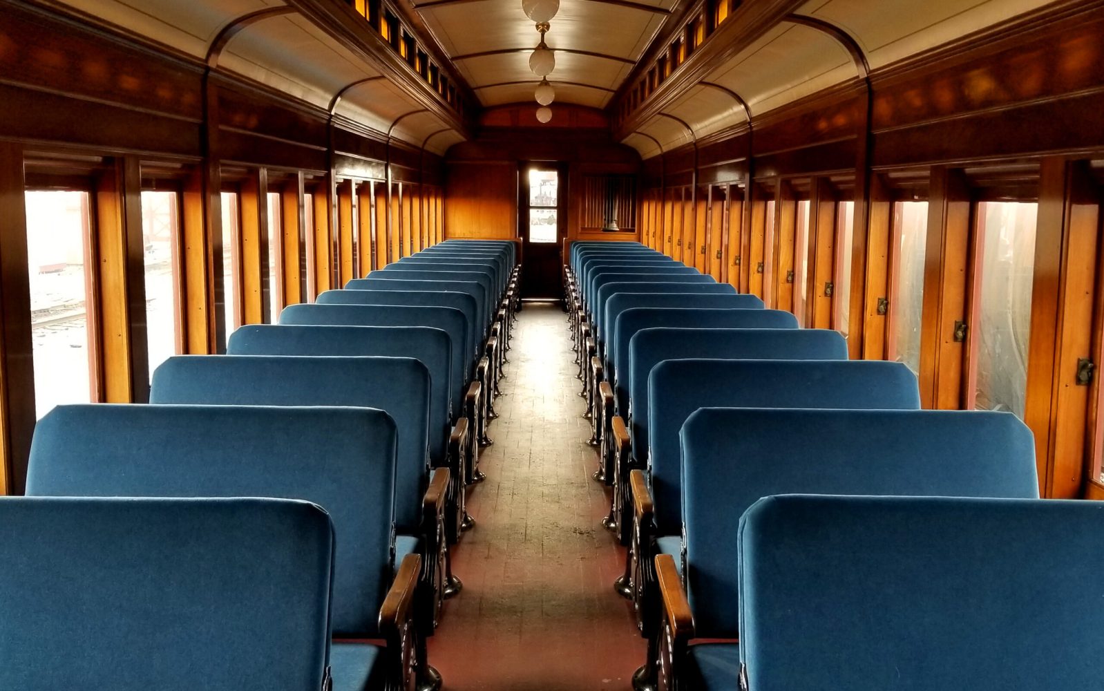 Two rows of empty coach seating on the Strasburg Rail Road.