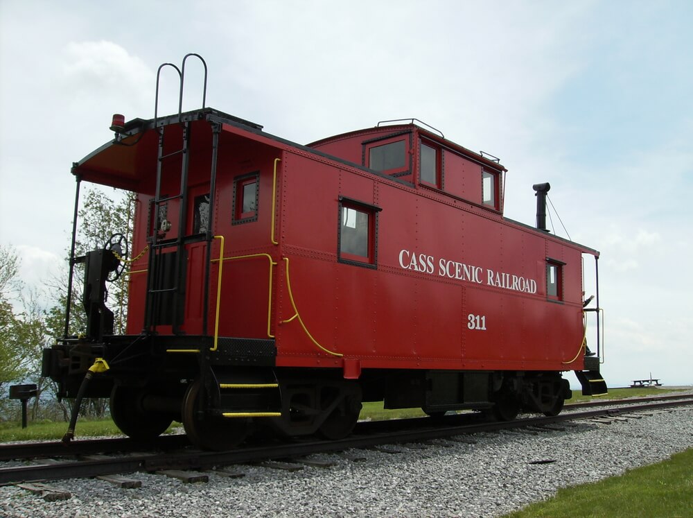 Cass Scenic Railroad car #311 that is parked on a track.