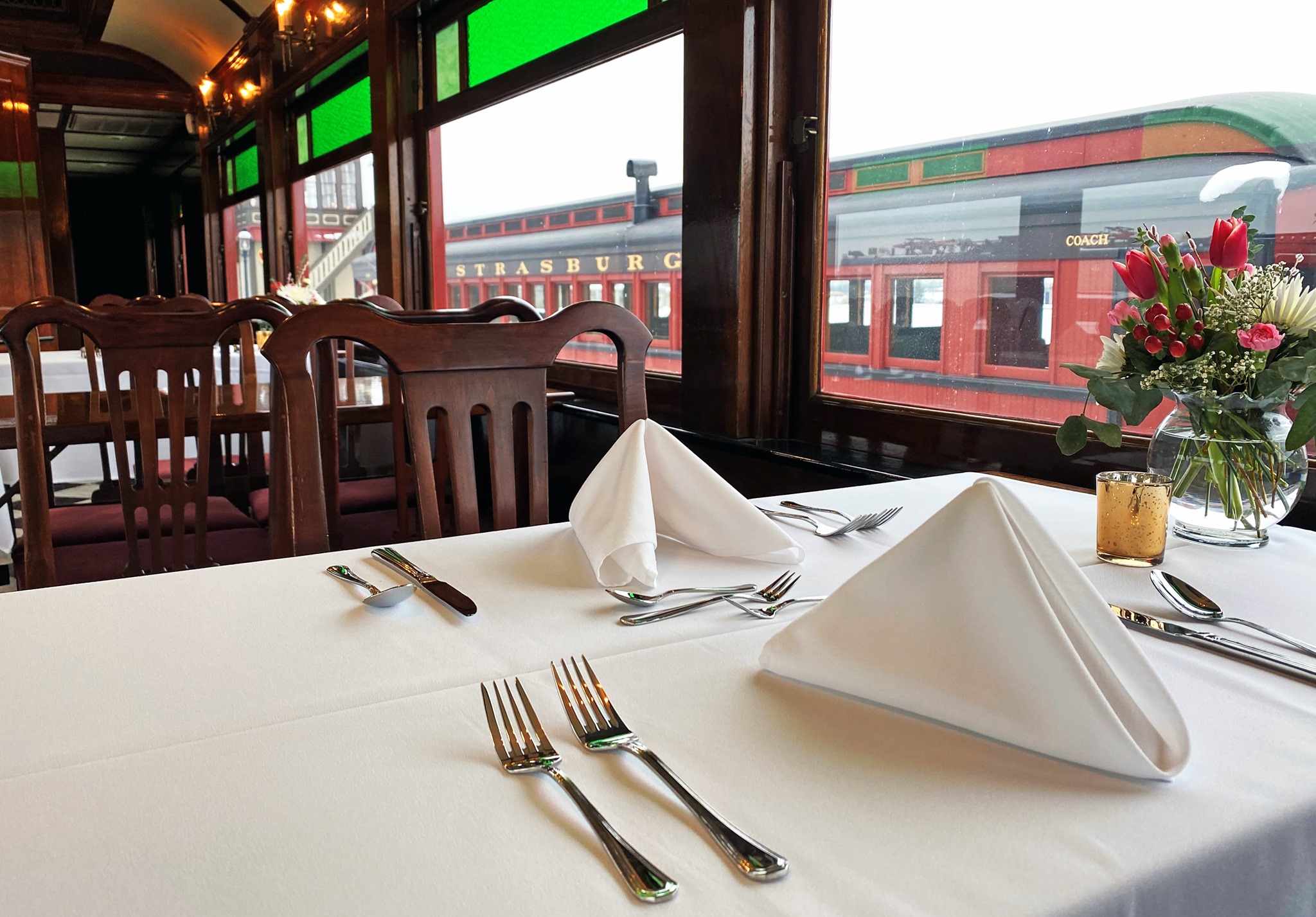 A dining table inside of a dining train.