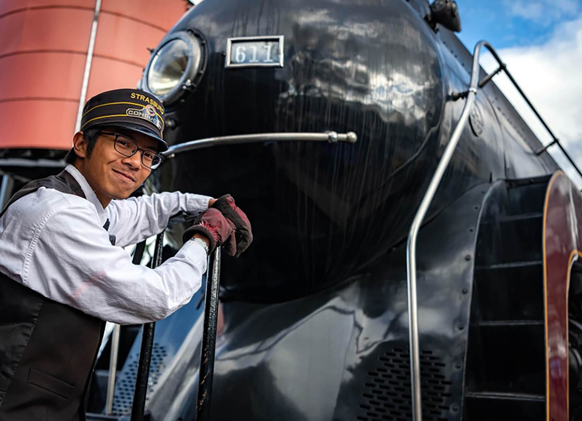 Gabe Miranda Conductor (1) strasburg rail road's train conductor standing in from of the 611